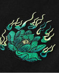 Close-up of the small embroidered flaming lotus on the front chest
