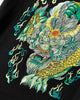 Close-up of the embroidered pixiu head in green, pale green and gold thread