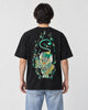 Model wearing the black pixiu embroidered T-shirt with light-wash jeans, back view