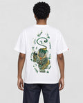 Model wearing the white pixiu embroidered T-shirt with dark jeans, back view