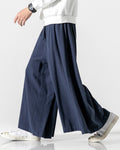 Navy extra-wide linen-cotton skirt pants in motion, showing how the wide legs swing