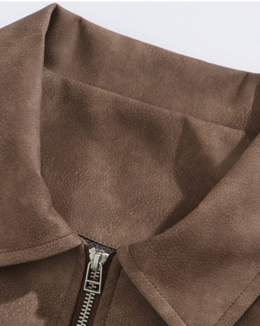 Close-up of the brown faux suede collar and zip