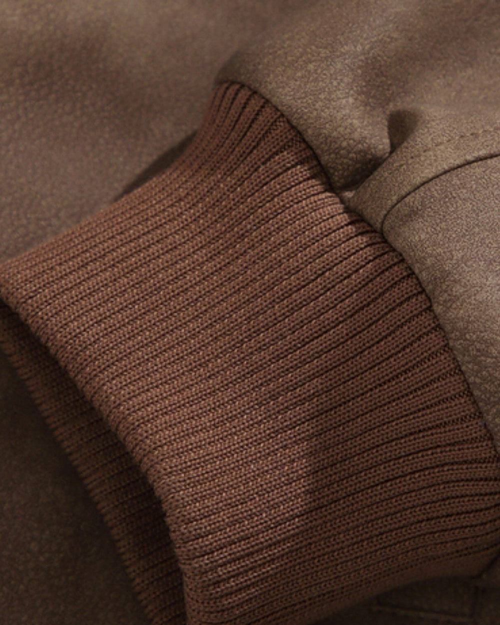 Close-up of the rib-knit cuff and the seam across the sleeve