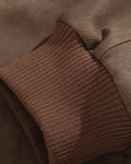 Close-up of the rib-knit cuff and the seam across the sleeve
