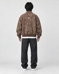 Model wearing the brown faux suede bomber, back view