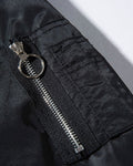 Close-up of the ring-pull zip pocket on the sleeve