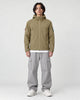 Model wearing the khaki softshell hooded jacket, front view