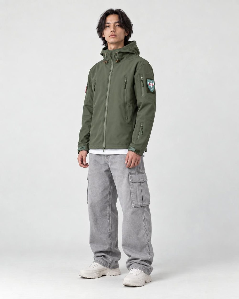 Model wearing the army green softshell jacket, three-quarter view