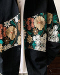 Close-up of the floral tapestry band on the black shirt jacket