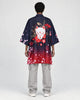 Model wearing the navy and red haori, back view with the white fox mask print