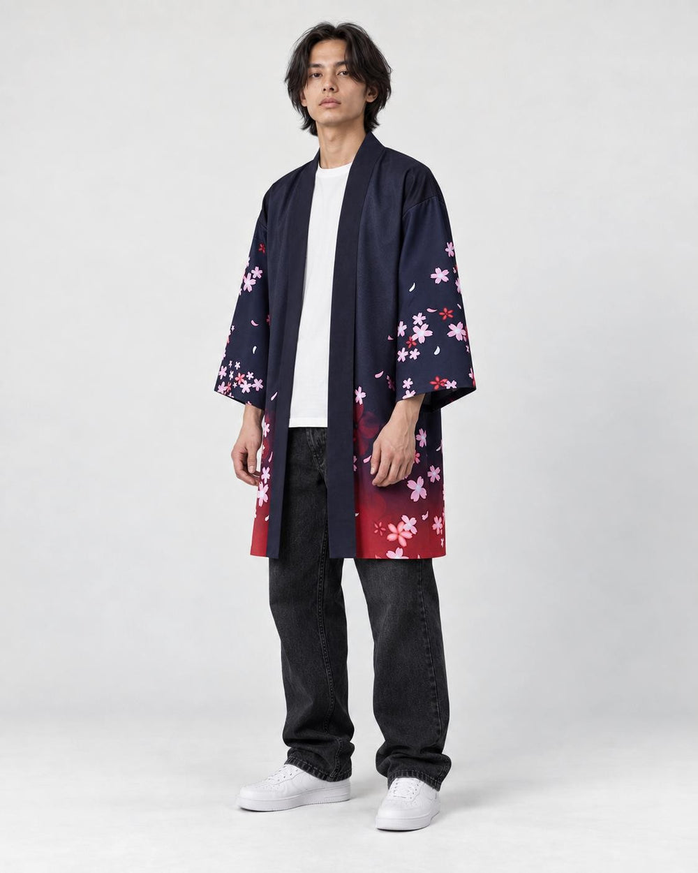Model wearing the navy haori with cherry blossoms and dark jeans, three-quarter view