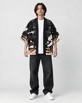 Model wearing the black fox mask kimono open over a white tee, front view