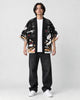 Model wearing the black fox mask kimono open over a white tee, front view
