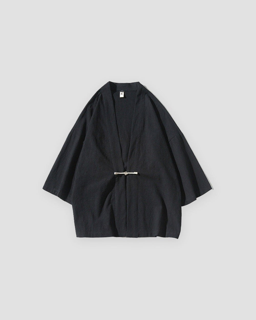 Black haori jacket with a knotted frog toggle, front view