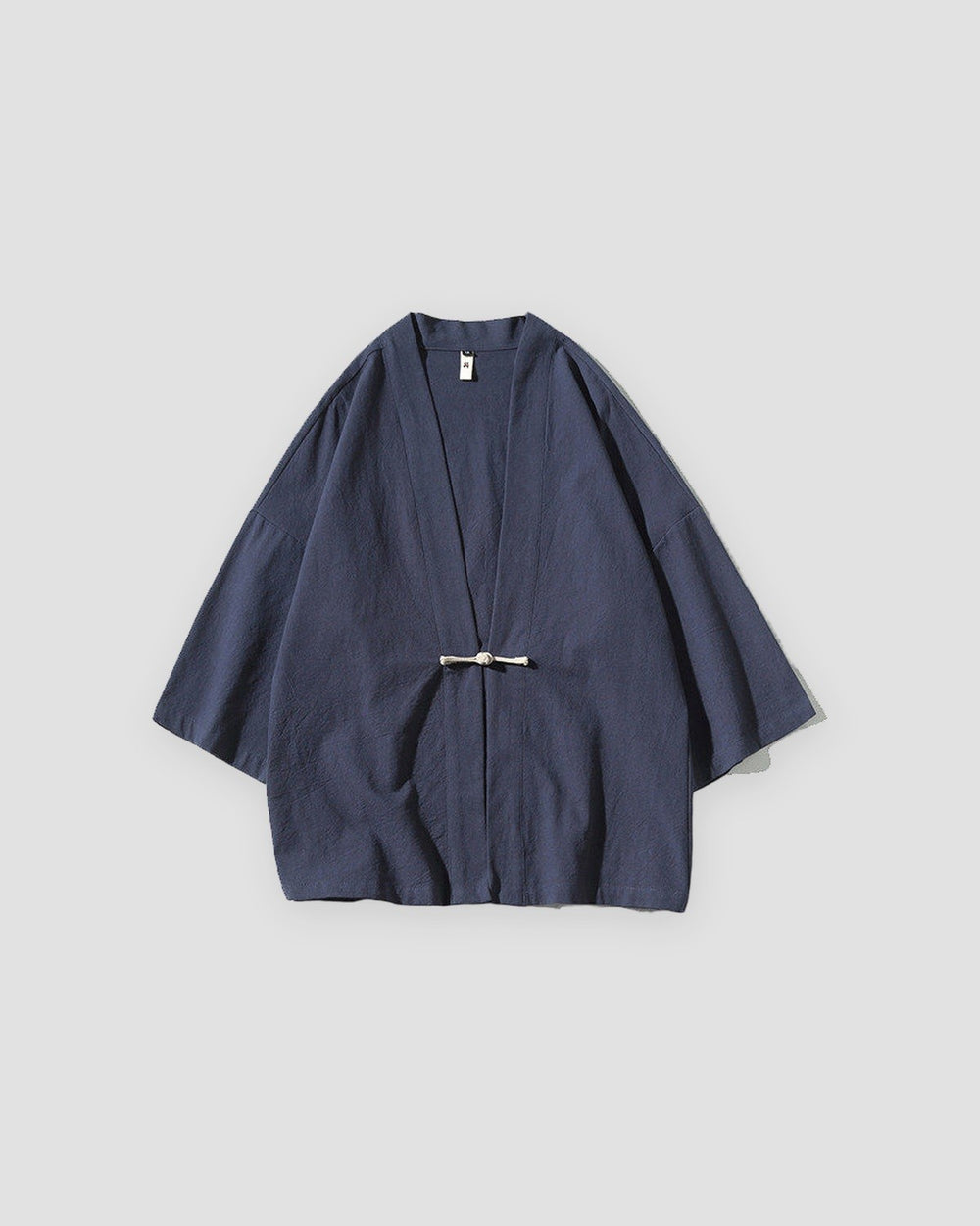 Navy haori jacket with a knotted frog toggle, front view