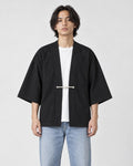 Model wearing the black haori jacket over a white tee, front view