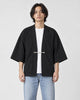 Model wearing the black haori jacket over a white tee, front view