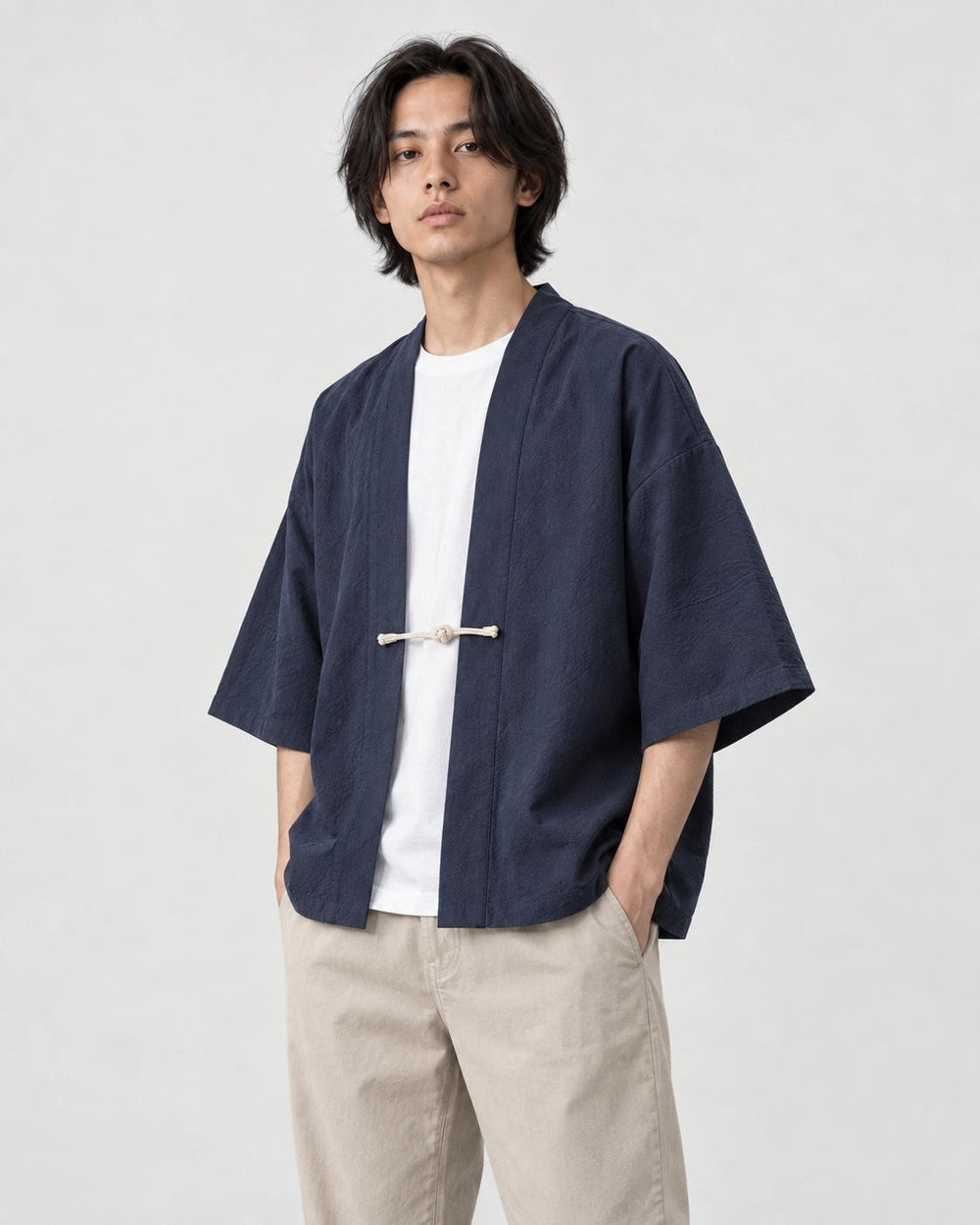 Model wearing the navy haori jacket, three-quarter view