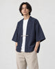 Model wearing the navy haori jacket, three-quarter view