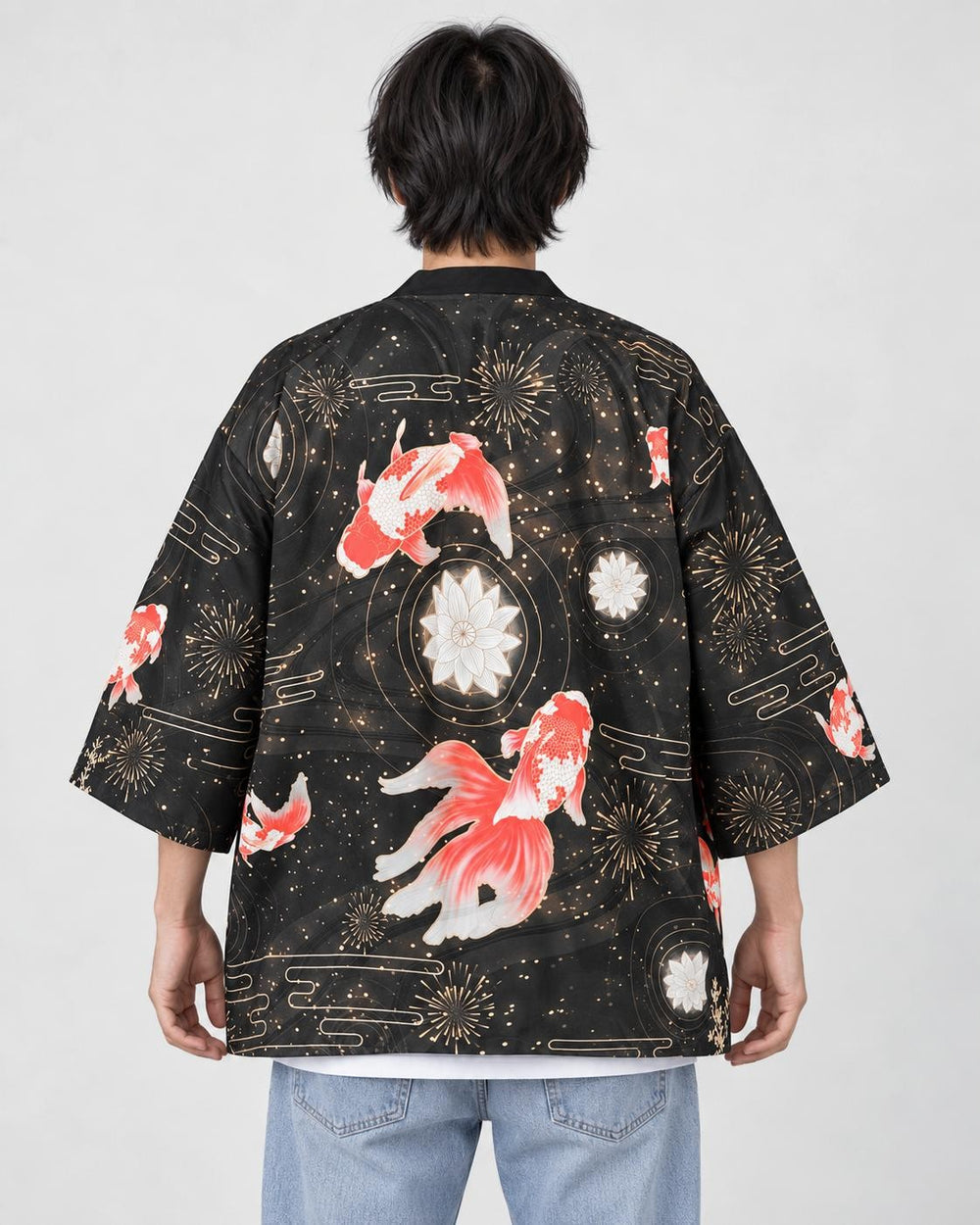 Model wearing the black goldfish and fireworks haori cardigan seen from behind over a white tee and light-wash jeans
