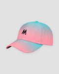 Baseball cap fading from aqua at the crown to coral pink at the brim, with a black M on the front
