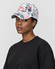 Model wearing the white graffiti print cap, three-quarter view