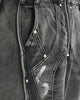 Close-up of the curved raised seams, rivets and white paint marks