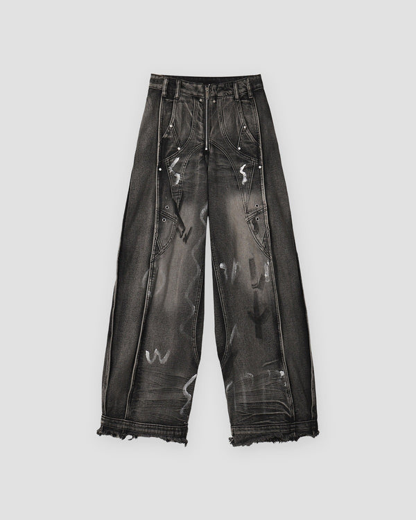 Washed black graffiti wide-leg jeans with raw hems, front view