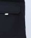 Close-up of the flap pocket on the black puffer jacket