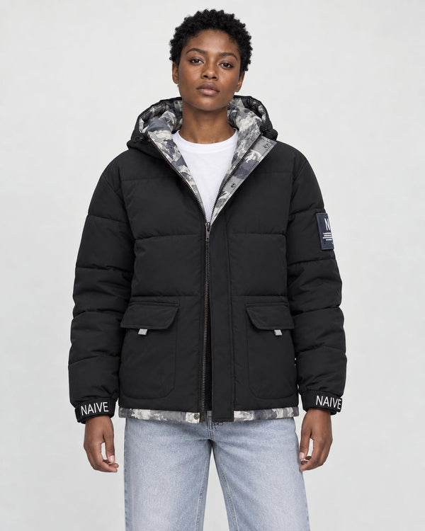 Model wearing the black puffer jacket with camouflage lining over a white tee, front view