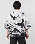 Model wearing the white haori cardigan with black ink-wash birds printed across the back, back view