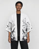 Model wearing the white haori cardigan open over a black tee, front view