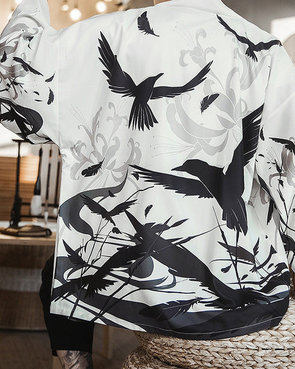 Back of the white haori printed with black birds in flight over gray spider lilies