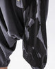 Close-up of the black ink splash print on the dark gray fabric