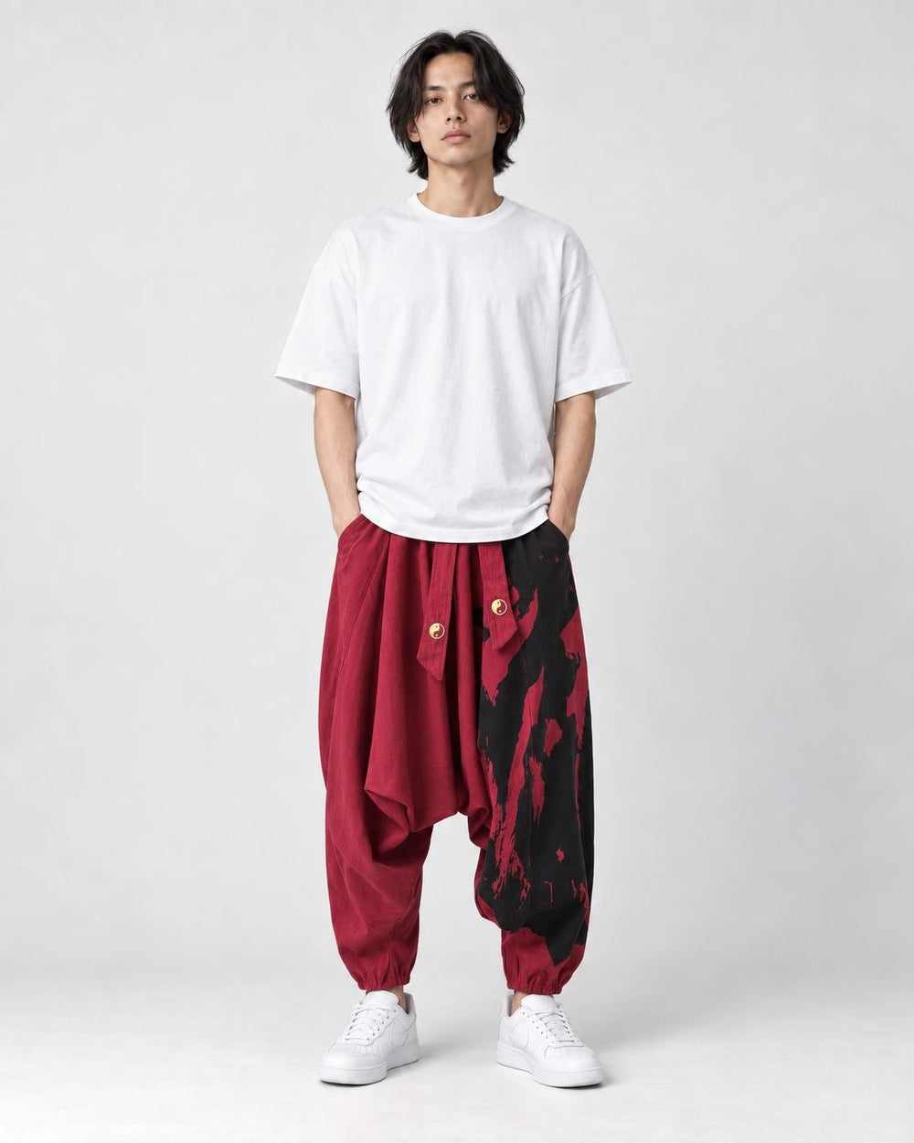 Model wearing the wine red ink splash harem pants, front view