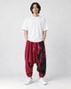 Model wearing the wine red ink splash harem pants, front view