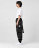 Model wearing the black cargo joggers, side view of the lettered hip straps