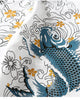 Close view of the blue-teal koi among white wave outlines and gold flowers on white cotton