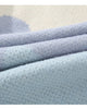 Close-up of the knitted color blocks and sky blue rib