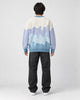 Model wearing the blue color block knit sweater, back view