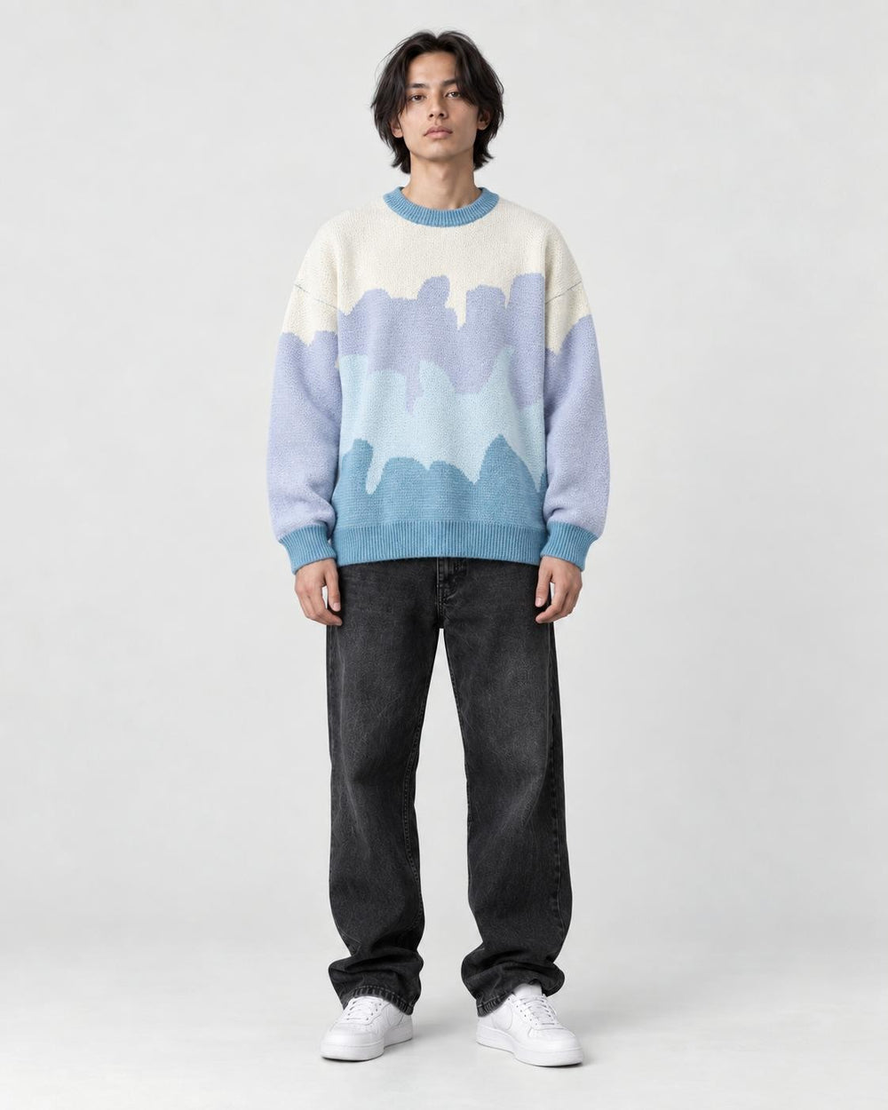 Model wearing the blue color block knit sweater, front view
