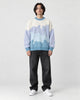 Model wearing the blue color block knit sweater, front view