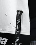 Close-up of the china lettering and ribbon straps on the hem