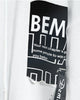 Close-up of the BEMC patch print and paint splatter on the white hoodie