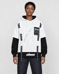 Model wearing the white layered hoodie with dark jeans, front view