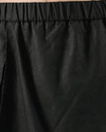Close-up of the elastic waistband and the split wrap panel
