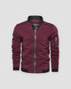 Burgundy bomber jacket with a black ribbed collar and a sleeve zip pocket, front view