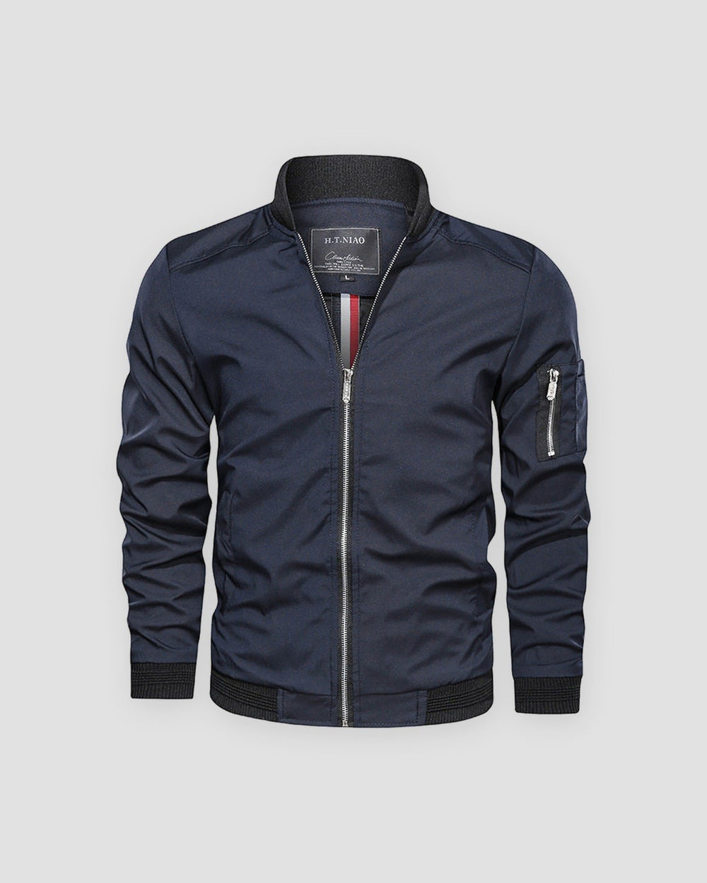 Navy bomber jacket with a black ribbed collar and a sleeve zip pocket, front view