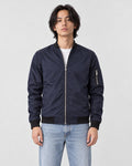 Model wearing the navy lightweight bomber jacket with a white tee, front view