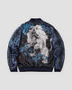 Black and navy souvenir jacket, back view, white lion embroidered among blue blossoms